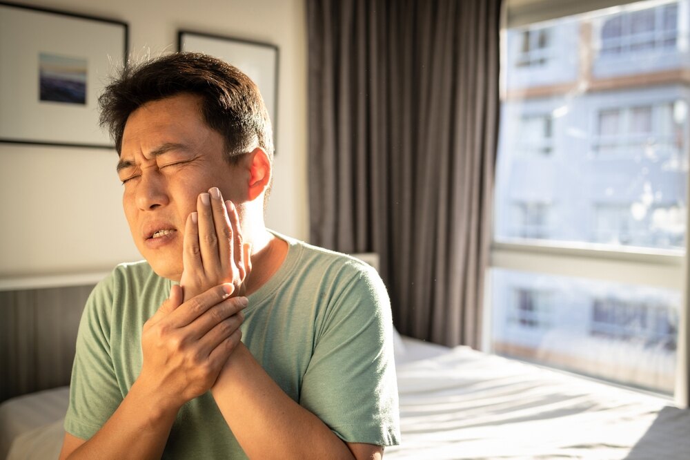 Patient consulting with a dentist about tooth extraction options